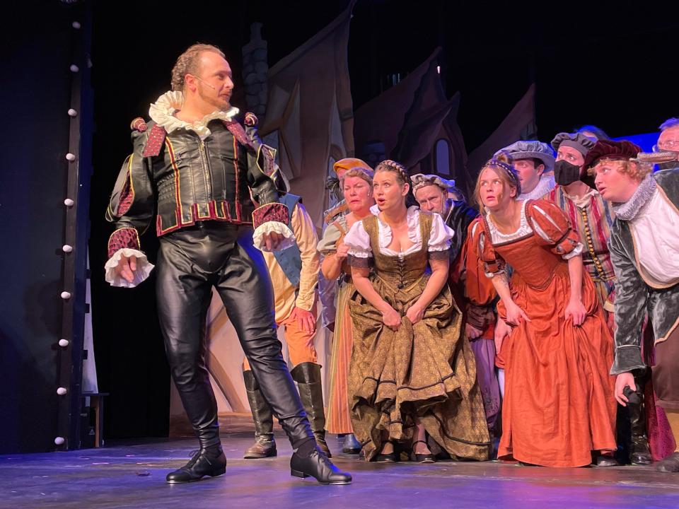 Keirnon McDermott as a dapper Shakespeare draws interest from the crowd in the Falmouth Theatre Guild's production of "Something Rotten!"