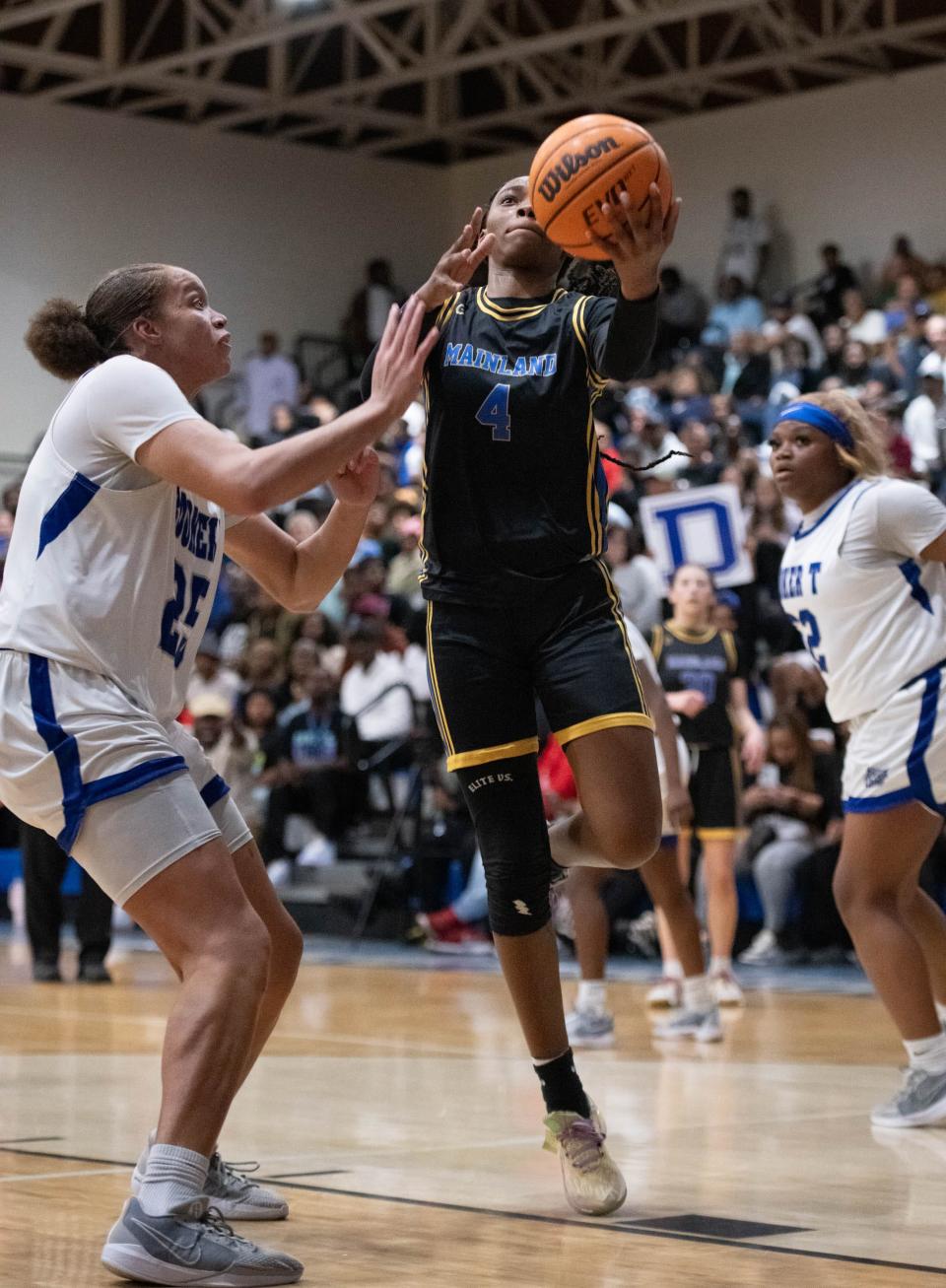 Anovia Sheals (4) takes it to the hoop during the Mainland vs Washington girls 5A Regional Finals basketball game at Booker T. Washington High School in Pensacola on Thursday, Feb. 22, 2024.