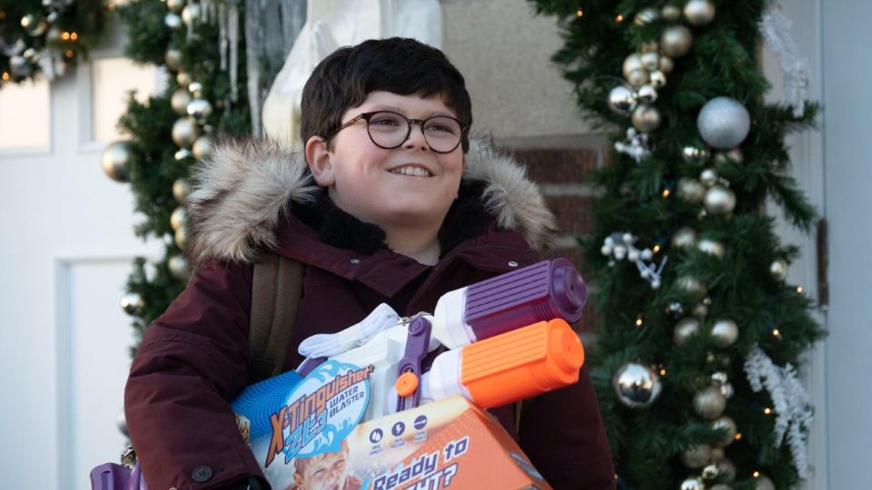 Boy holding presents