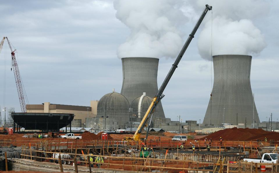 FILE -In this Dec. 11, 2012, file photo, part of the containment vessel for a new nuclear reactor at the Plant Vogtle nuclear power plant is under construction in Augusta, Ga. The Energy Department is poised to approve $6.5 billion in lending for two nuclear reactors under construction in Georgia. Energy Secretary Ernest Moniz is expected to announce the deal at a speech in Washington on Wednesday, a day before he visits the $14 billion Vogtle nuclear plant being built by Southern Co. and several partners about 30 miles southeast of Augusta. (AP Photo/John Bazemore, File)