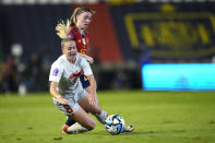 Switzerland's Nadine Riesen, left, and Spain's Eva Navarro fight for the ball during the women's Nations League group D soccer match between Spain and Switzerland at the Nuevo Arcangel stadium in Cordoba, Spain, Tuesday, Sept. 26, 2023. (AP Photo/Jose Breton)