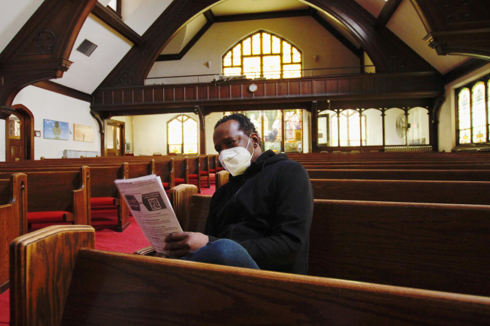 In this photo taken May 6, 2021, Michael Adkins sits in the sanctuary of St. Matthew Christian Methodist Episcopal Church, in Milwaukee, after receiving a vaccination. It's one of the churches that was part of an effort with Pastors United, Milwaukee Inner City Congregations Allied for Hope, Souls to the Polls and the local health clinic Health Connections to get people vaccinated directly in churches. (AP Photo/Carrie Antlfinger)