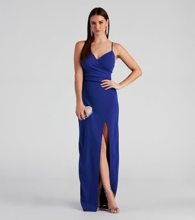 <p><a href="https://go.redirectingat.com?id=74968X1596630&url=https%3A%2F%2Fwww.windsorstore.com%2Fproducts%2Fsasha-formal-high-slit-wrap-dress-050026236001%3Fvariant%3D30332973023283%26flow_country%3DUSA%26gclid%3DCjwKCAjwo_KXBhAaEiwA2RZ8hEJOGtNnRVTu4reiqS90AFdPVJmxoGB6tDwSquFggSqlXcQgX1hsABoCXf0QAvD_BwE&sref=https%3A%2F%2Fwww.thepioneerwoman.com%2Ffashion-style%2Fg40924270%2Fbest-fall-wedding-guest-dresses%2F" rel="nofollow noopener" target="_blank" data-ylk="slk:Shop Now;elm:context_link;itc:0;sec:content-canvas" class="link ">Shop Now</a></p><p>Windsor Sasha Formal High Slit Wrap Dress</p><p>$39.90</p><p>windsorstore.com</p><span class="copyright">Windsor</span>