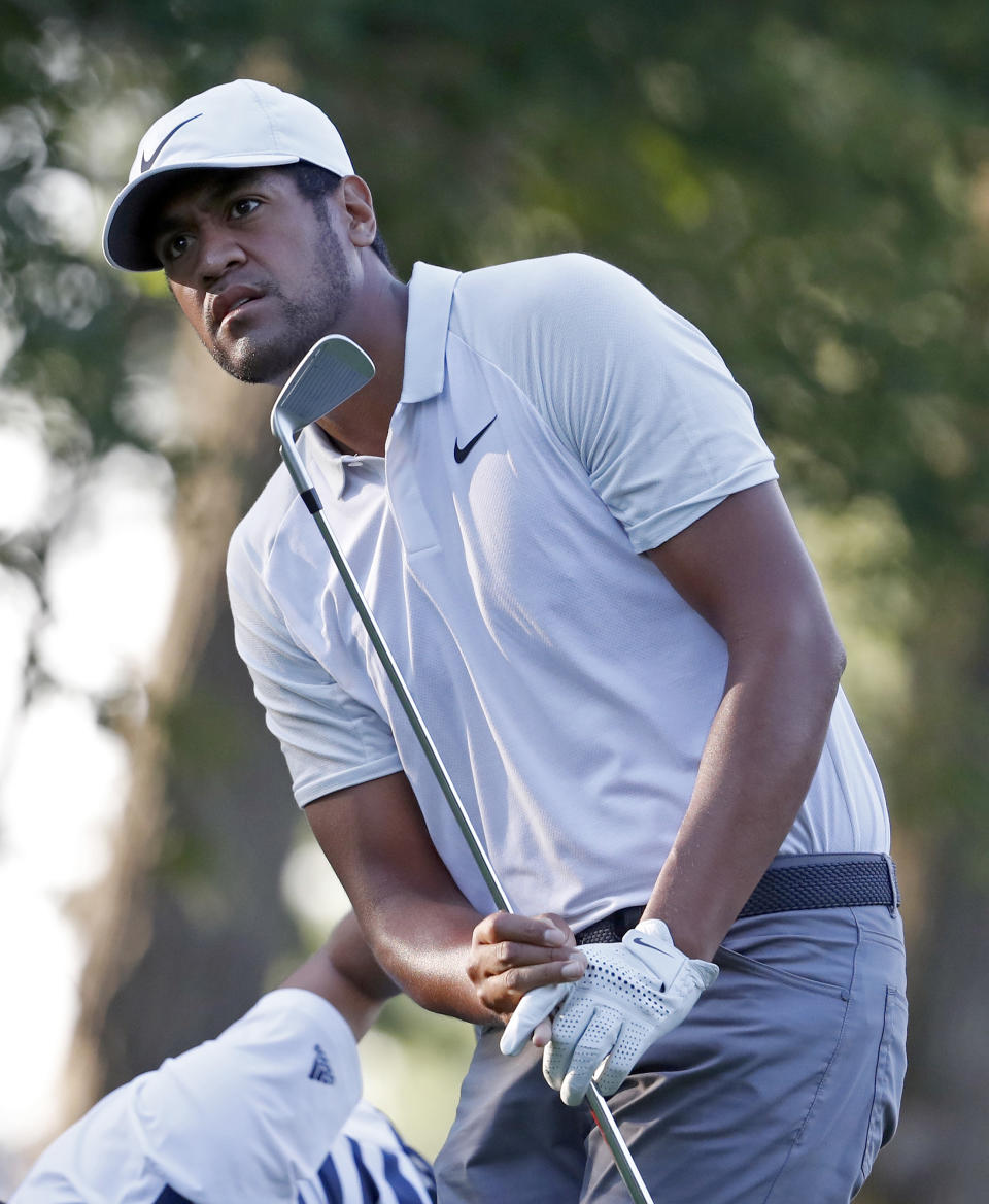 Tony Finau watches his tee shot on the 11th hole during the first round of the PGA Championship golf tournament at Bellerive Country Club, Thursday, Aug. 9, 2018, in St. Louis. (AP Photo/Jeff Roberson)