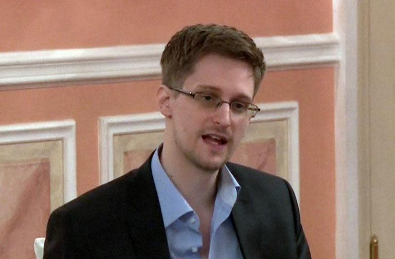 An image grab taken from a video released by WikiLeaks on October 12, 2013 shows US intelligence leaker Edward Snowden speaking during a dinner with US ex-intelligence workers and activists in Moscow on October 9, 2013