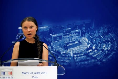 Swedish environmental activist Greta Thunberg delivers a speech before a debate with French parliament members at the National Assembly in Paris