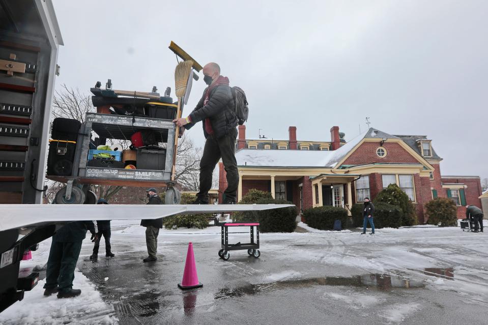 Production crews move equipment from the Wamsutta Club (James Arnold Mansion) where they are filming The Holdovers.