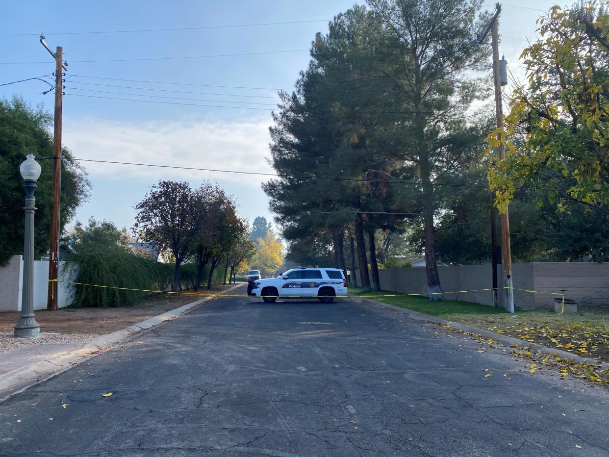 Phoenix police tape blocks off the crime scene early Monday where former Maricopa County Attorney Allister Adel's widower allegedly killed two women and himself during a holiday gathering Sunday night, Dec. 24, 2023.