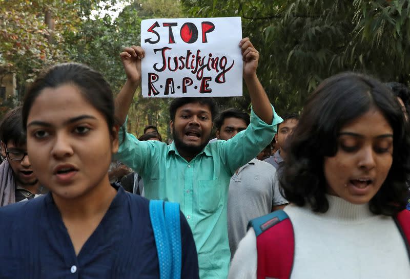 Students shout slogans during a protest against the alleged rape and murder of a 27-year-old woman, in Kolkata
