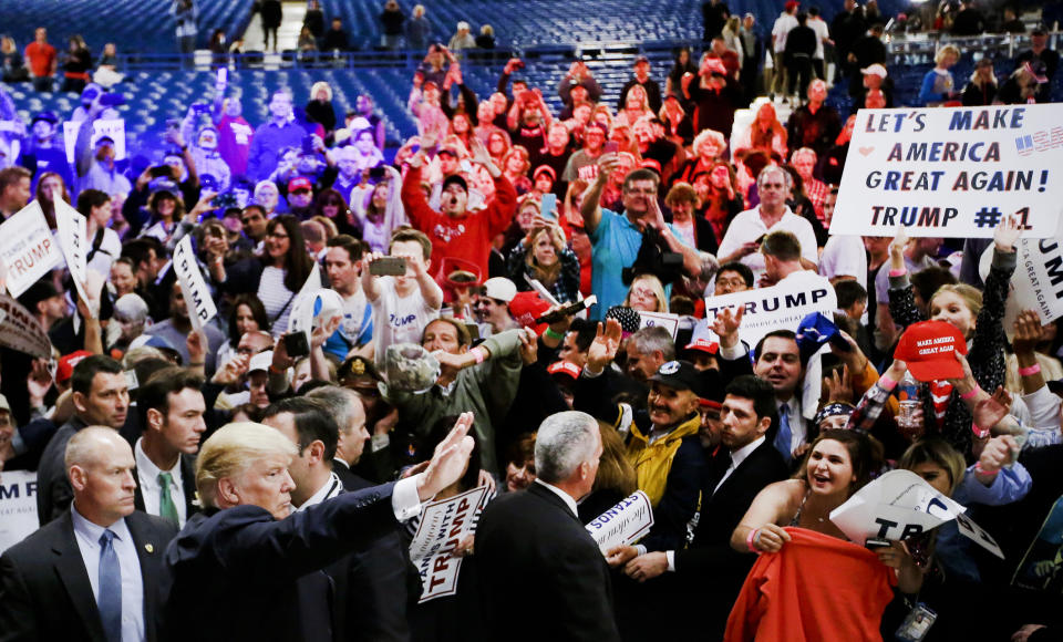 FILE - In this April 28, 2016, file photo, Republican presidential candidate Donald Trump, bottom second from left, greets supporters after a rally in Costa Mesa, Calif. California Republican leaders are gathering the weekend of Sept. 6-8, 2019, to map out an election strategy in an increasingly Democratic state that President Trump lost by over 4 million votes in 2016. The outlook is challenging. Democrats control every statewide office and both chambers of the Legislature. (AP Photo/Chris Carlson, File)