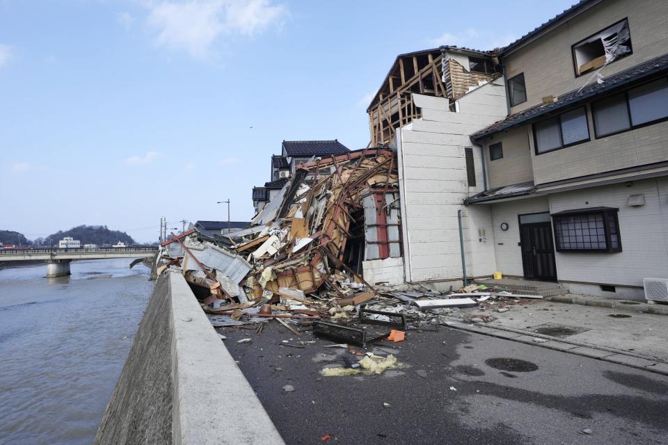 Damaged buildings are seen in Wajima in the Noto peninsula, facing the Sea of Japan, northwest of Tokyo, Saturday, Jan. 6, 2024, following Monday's deadly earthquake. (AP Photo/Hiro Komae)