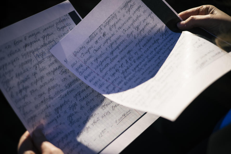 Lisa Sales holds a handwritten letter