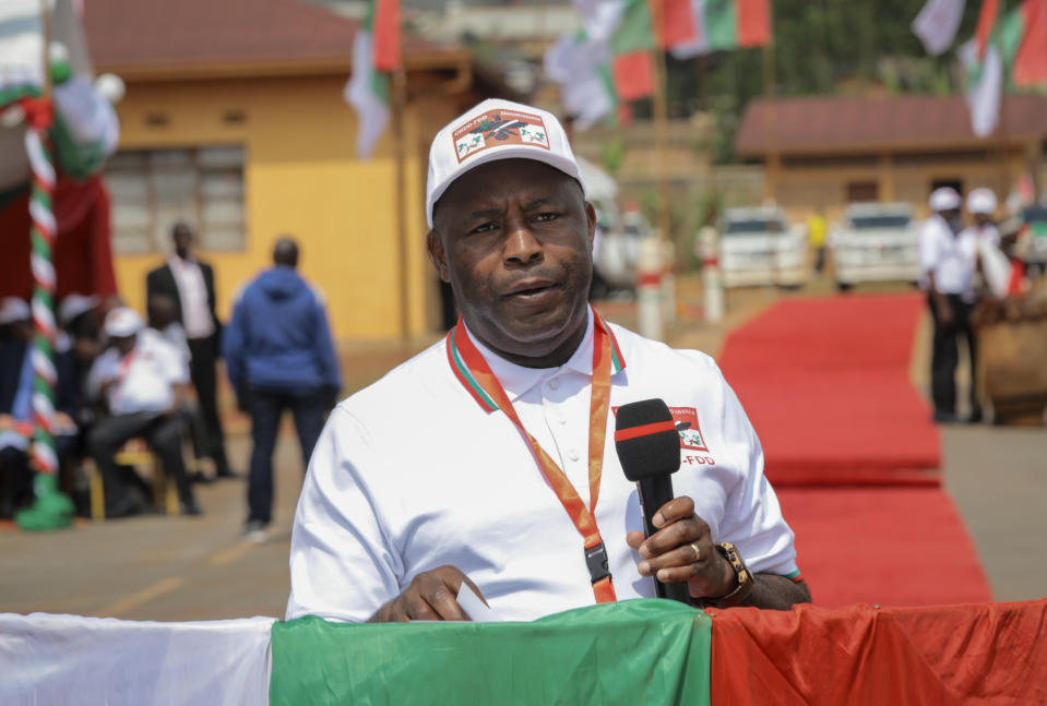 Burundi Army Gen. Evariste Ndayishimiye speaks to party supporters after being chosen as their presidential candidate, at a national conference for the ruling CNDD-FDD party in the rural province of Gitega, Burundi Sunday, Jan. 26, 2020. Burundi's ruling party chose Gen. Evariste Ndayishimiye to be its candidate in the presidential election set for May, signaling that the country's current president Pierre Nkurunziza will now retire after serving three terms. (AP Photo/Berthier Mugiraneza)