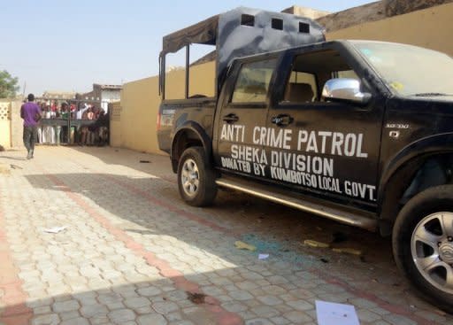 A resident walks inside the premises of partially burnt police station in Sheka neighbourhood in northern Nigerian city of Kano on January 25. Attackers armed with bombs and guns opened fire at outdoor church services at a university in the city, killing around 20 people as worshippers tried to flee, witnesses and officials said