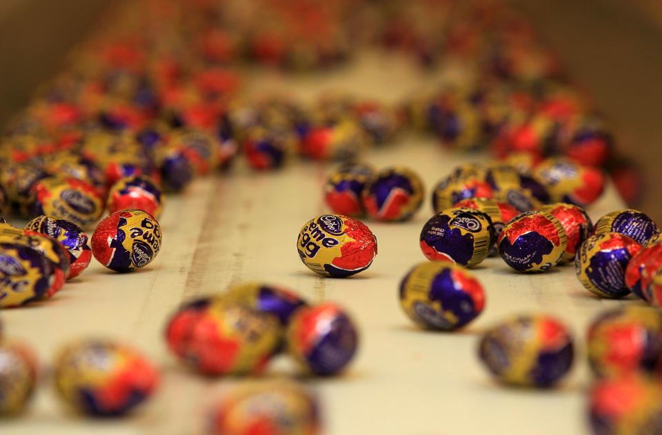 Cadbury's Creme Eggs move down the production line at the Cadbury's Bournville production plant on December 15, 2009 in Birmingham, England. The historic confectioner is facing a hostile bid from food company Kraft. Workers and members of the union Unite held a meeting today and urged shareholders to resist selling up and to keep the company in British hands.  (Photo by Christopher Furlong/Getty Images)