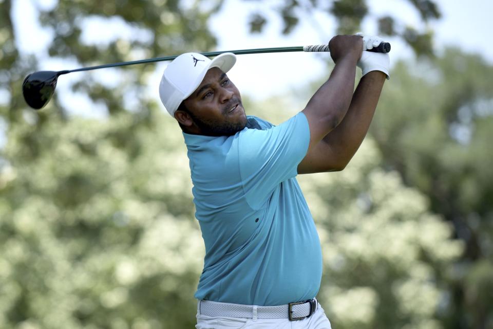 Harold Varner III watches his tee shot on the third hole during the third round of the Charles Schwab Challenge golf tournament at the Colonial Country Club, Saturday, May 28, 2022, in Fort Worth, Texas. (AP Photo/Emil Lippe)