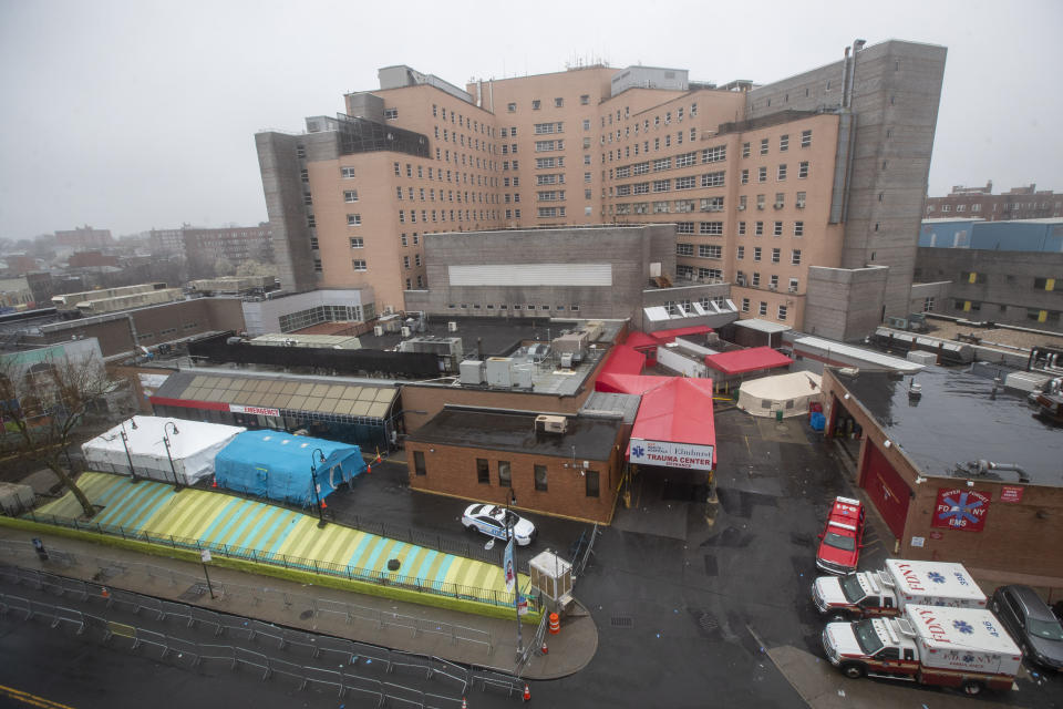 The tents used to test for COVID-19 at Elmhurst Hospital Center are seen next to the Trauma Center entrance, Sunday, March 29, 2020, in the Queens borough of New York. The new coronavirus causes mild or moderate symptoms for most people, but for some, especially older adults and people with existing health problems, it can cause more severe illness or death. (AP Photo/Mary Altaffer)