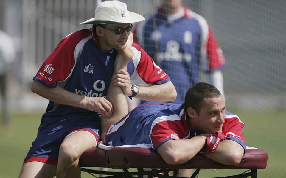 Simon Jones of England has treatment on his leg by Physio Mark Saxby during the England nets session at the Brabourne Cricket ground on February 16, 2006 in Mumbai, India - Getty Images 