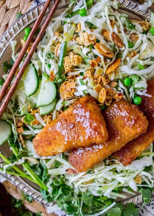 Crispy fish over cabbage salad.