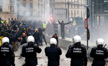 Far-right supporters face off with police during a protest against Marrakesh Migration Pact in Brussels, Belgium December 16, 2018. REUTERS/Francois Lenoir