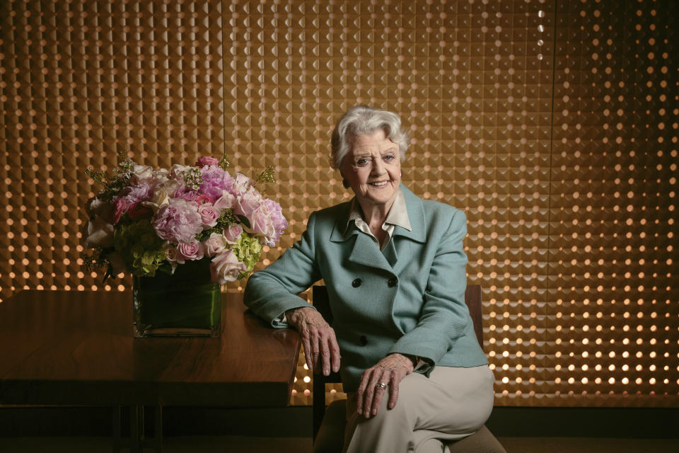 FILE - Angela Lansbury poses for a portrait during press day for "Blithe Spirit" in Los Angeles on Dec. 16, 2014. Lansbury, the big-eyed, scene-stealing British actress who kicked up her heels in the Broadway musicals “Mame” and “Gypsy” and solved endless murders as crime novelist Jessica Fletcher in the long-running TV series “Murder, She Wrote,” died peacefully at her home in Los Angeles on Tuesday. She was 96. (Photo by Casey Curry/Invision/AP, File)