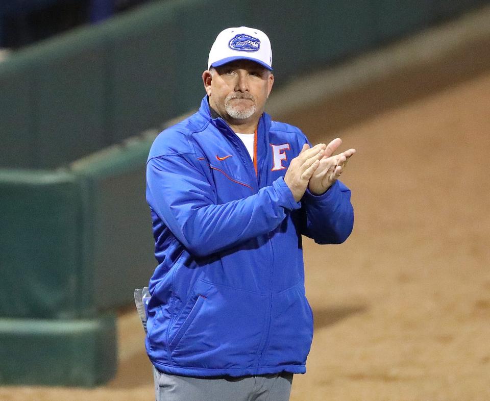 University of Florida head coach Tim Walton applauds as the team  gets ready to play the home opener against Jacksonville at Katie Seashole Pressly stadium in Gainesville, Feb. 16, 2022. The Gators beat Jacksonville 8-0 to stay undefeated on the season.