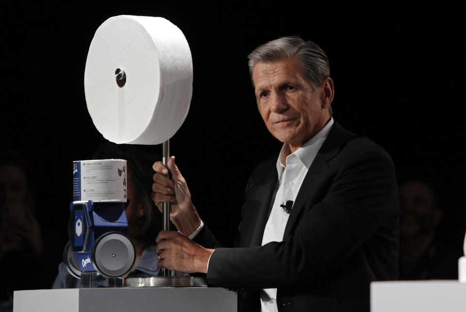 Procter & Gamble Chief Brand Officer Marc Pritchard shows off the Charmin Forever Roll and the Charmin RollBot during a Procter & Gamble news conference before CES International, Sunday, Jan. 5, 2020, in Las Vegas. (AP Photo/John Locher)