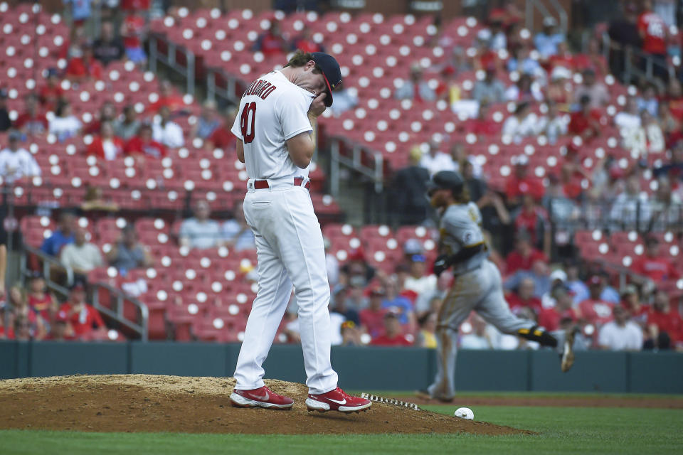 St. Louis Cardinals relief pitcher Jake Woodford, left, looks on after giving up a home run to Pittsburgh Pirates' Ben Gamel during the fifth inning of a baseball game Sunday, June 27, 2021, in St. Louis. (AP Photo/Joe Puetz)