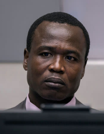 Dominic Ongwen, a former senior rebel commander from the Lord's Resistance Army in Uganda, sits in the courtroom of the International Criminal Court (ICC) during the confirmation of charges in The Hague, the Netherlands January 21, 2016. REUTERS/Michael Kooren/File Photo