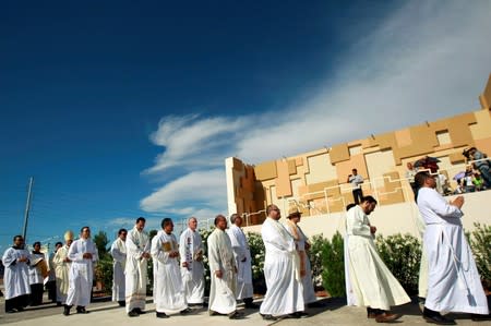 FILE PHOTO: Members of the Catholic Church take part in a "Mass for the Peace" a week after a mass shooting at a Walmart store in El Paso, Texas, U.S., at the border between Mexico and the U.S. in Ciudad Juarez