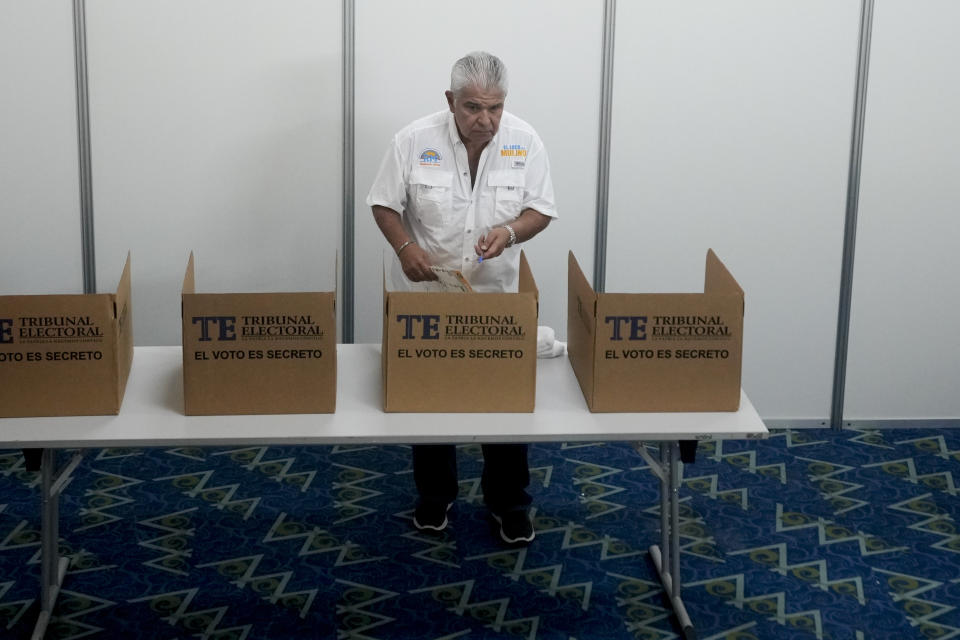 Achieving Goals presidential candidate Jose Raul Mulino holds his ballot during a general election in Panama City, Sunday, May 5, 2024. (AP Photo/Matias Delacroix)