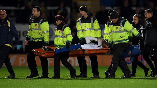 Coutts taken from the ground by medical staff. Image: Getty