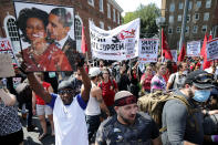 <p>Counter-protesters line the route taken by white nationalists, neo-Nazis and members of the ‘alt-right’ during the ‘Unite the Right’ rally August 12, 2017 in Charlottesville, Virginia. After clashes with anti-fascist protesters and police the rally was declared an unlawful gathering and people were forced out of Lee Park, where a statue of Confederate General Robert E. Lee is slated to be removed. (Photo: Chip Somodevilla/Getty Images) </p>