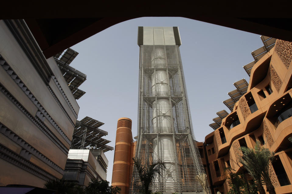 FILE - This Jan. 16, 2011 file photo, shows a wind tower that brings upper level wind to the public square at the Masdar Institute campus as a part of Masdar City, in Abu Dhabi, United Arab Emirates. Although all six Gulf states remain heavily reliant on fossil fuels for state spending, each has taken steps to try and diversify their economies, with Saudi Arabia and the UAE leading aggressive efforts to attract other forms of investment in new industries. (AP Photo/Kamran Jebreili, File)