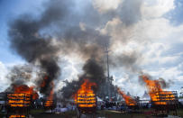 Thousands of rhino horns kept in government custody for decades are burned at an event to mark World Rhino Day in Bokakhat near Kaziranga National Park, north-eastern Assam state, India, Wednesday, Sept.22, 2021. The horns were of rhinos that died of natural causes at Kaziranga and other smaller habitats across Assam and those confiscated from poachers. Kaziranga is home to nearly 2,500 one-horned rhinos, the world’s largest habitat of this rare animal. (AP Photo/Anupam Nath)