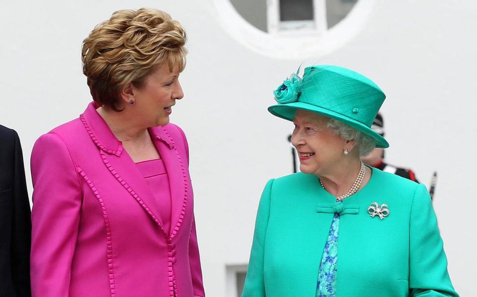 Mary McAleese talks to the Queen during her historic four-day visit to Ireland in 2011 - Peter Muhly/AFP