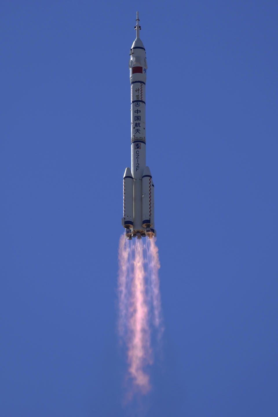 A Long March-2F Y12 rocket carrying a crew of Chinese astronauts in a Shenzhou-12 spaceship lifts off at the Jiuquan Satellite Launch Center in Jiuquan in northwestern China, Thursday, June 17, 2021. China has launched the first three-man crew to its new space station in its the ambitious programs first crewed mission in five years. (AP Photo/Ng Han Guan)