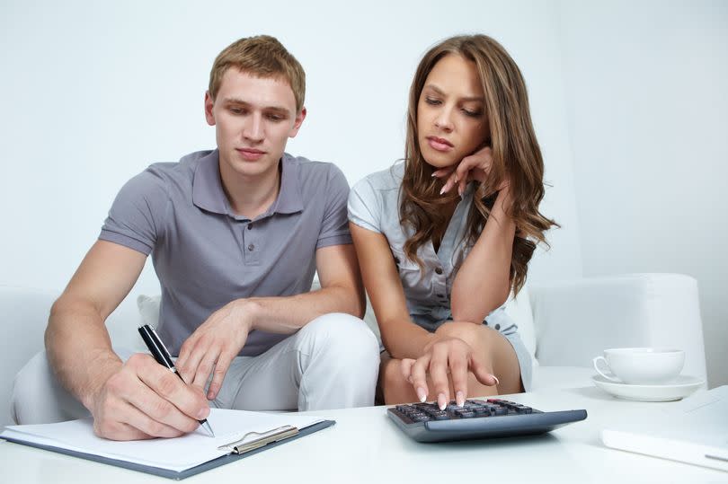 Young couple planning their budget
