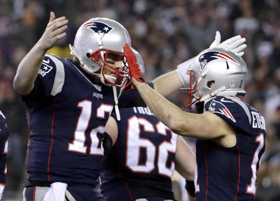 New England Patriots quarterback Tom Brady (12) celebrates with wide receiver Julian Edelman (11) after throwing a touchdown pass during the second half of the AFC championship NFL football game against the Pittsburgh Steelers, Sunday, Jan. 22, 2017, in Foxborough, Mass. (AP Photo/Matt Slocum)