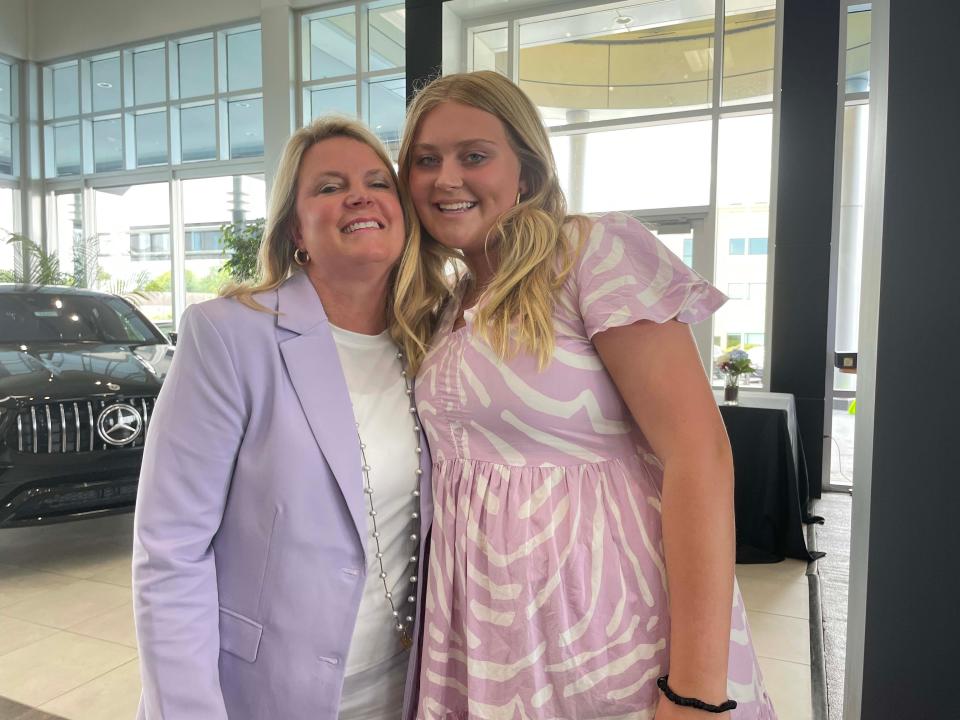 Lee Ann Furrow Tolsma, president of Furrow Automotive Group,  and her daughter Lee Belle Tolsma share a moment at the presentation of $10,000 each to Young-Williams Animal Center and the Humane Society of Tennessee Valley at the Mercedes-Benz Knoxville dealership Thursday, July 21, 2022.