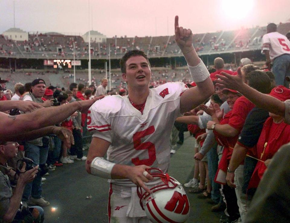 Wisconsin quarterback Brooks Bollinger points out his teams 42-17 upset victory over No. 12 Ohio State in Columbus, Ohio, in 1999.