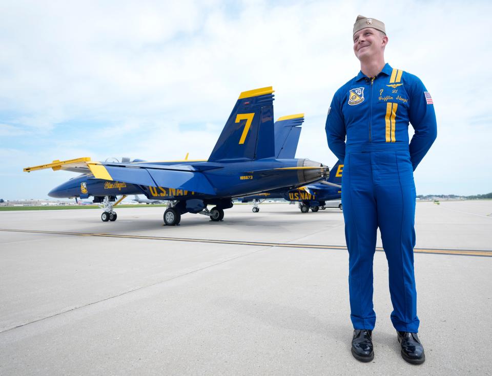 Navy Blue Angels pilot Lt. Griffin Stangel, a Madison native, stands near an F/A-18 Super Hornet after he and members of Blue Angels stopped at the 128th Air Refueling Wing near Milwaukee Mitchell International Airport on Thursday. Stangel will serve as a narrator for the Milwaukee Air & Water Show this weekend.