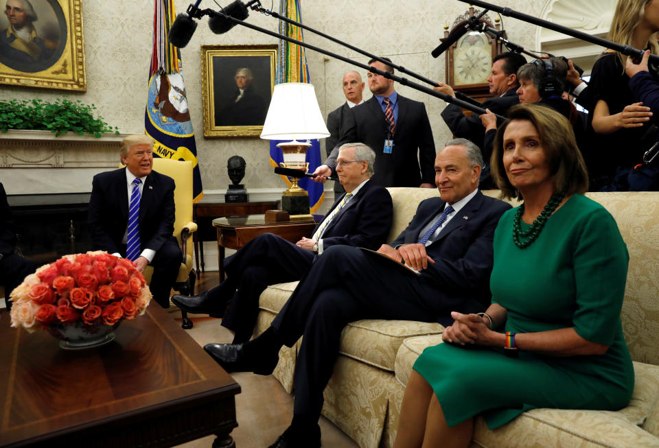 President Trump meets with Senate Majority Leader Mitch McConnell, Senate Democratic leader Chuck Schumer, House Minority Leader Nancy Pelosi, left to right, and other congressional leaders in the Oval Office of the White House on Sept. 6, 2017. (Photo: Kevin Lamarque/Reuters)