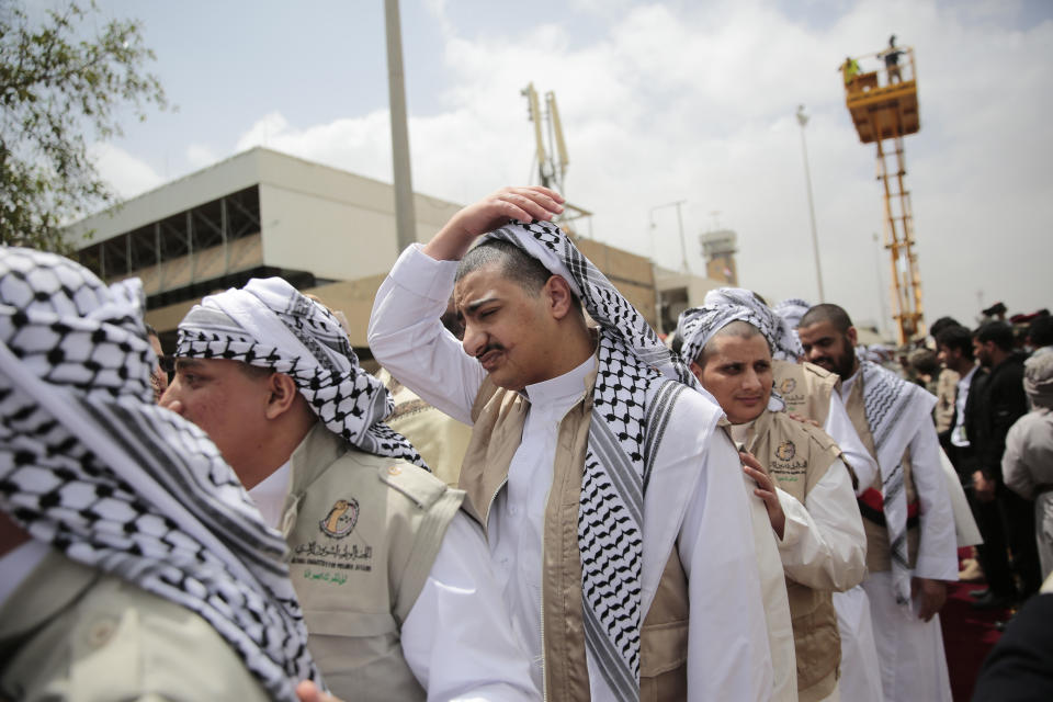 Houthi prisoners arrive to Sanaa airport, Saturday, April 15, 2023. An exchange of more than 800 prisoners linked to Yemen's long-running war them began Friday, the International Committee for the Red Cross said. The three-day operations will see flights transport prisoners between Saudi Arabia and Yemen's capital, Sanaa, long held by the Iranian-backed Houthi rebels. ((AP Photo/Hani Mohammed)