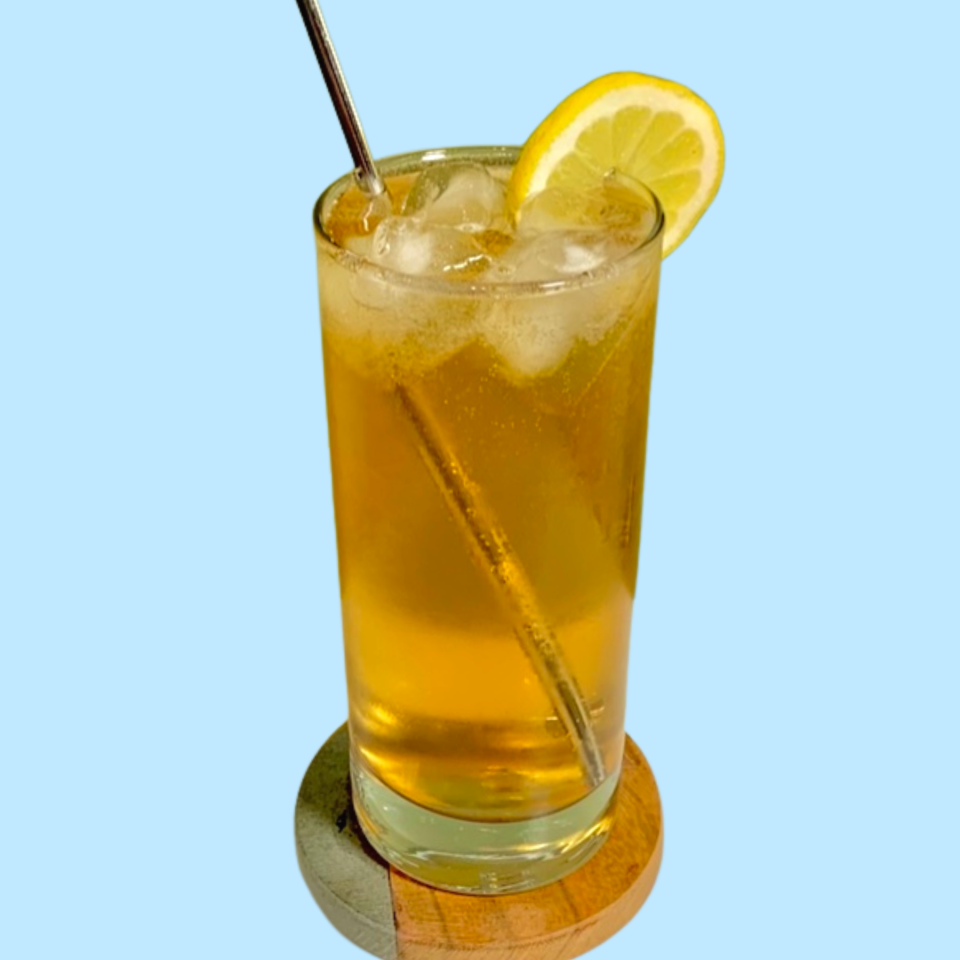 tall glass with a lemon garnish