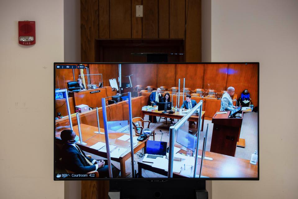 A video screen in a viewing room of the Bergen County Courthouse displays the trial of (left) Lexie Burke in the courtroom of Judge Margaret Foti on Tuesday, February 15, 2022. (right) Burke's attorney Ronald Hunt. Burke is one of four men involved in a botched Fairview drug deal that left one dead.