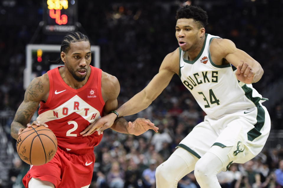 Raptors forward Kawhi Leonard drives against Bucks forward Giannis Antetokounmpo during the second half of Game 5. (AP)