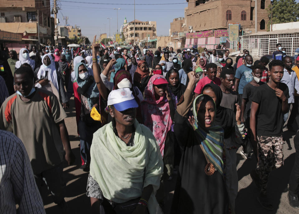 Thousands of protesters take to the streets to renew their demand for a civilian government in the Sudanese capital Khartoum, Thursday, Nov. 25, 2021. The rallies came just days after the military signed a power-sharing deal with the prime minister, after releasing him from house arrest and reinstating him as head of government. The deal came almost a month after the generals orchestrated a coup. Sudan’s key pro-democracy groups and political parties have dismissed the deal as falling short of their demands for a fully civilian rule. (AP Photo/Marwan Ali)