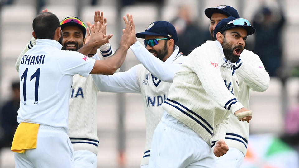 Seen here, India players celebrate a wicket on day five of the World Test Championship final.