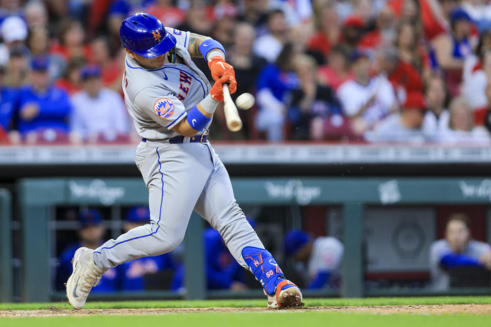New York Mets' Francisco Alvarez hits a solo home run during the sixth inning of a baseball game against the Cincinnati Reds in Cincinnati, Tuesday, May 9, 2023. (AP Photo/Aaron Doster)